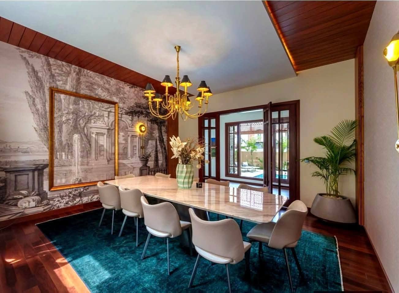Dining room with a full-wall mural and marble table